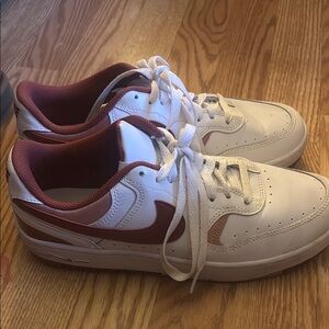 Pink and red women’s Nike shoes still with box